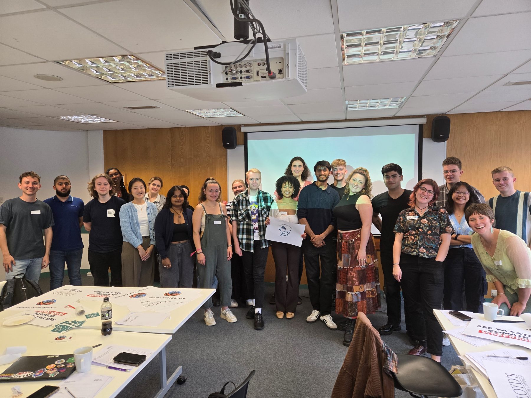 A photo of a group of young people at an Invest for Change workshop, they are all smiling