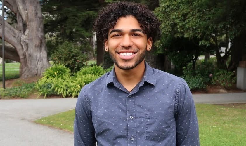 Lee, the author of the article, is standing in a garden and smiling